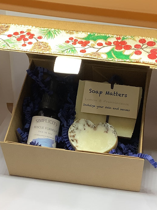Gift box with Christmas ribbon, award winning Face Oil, natural soap and a heart