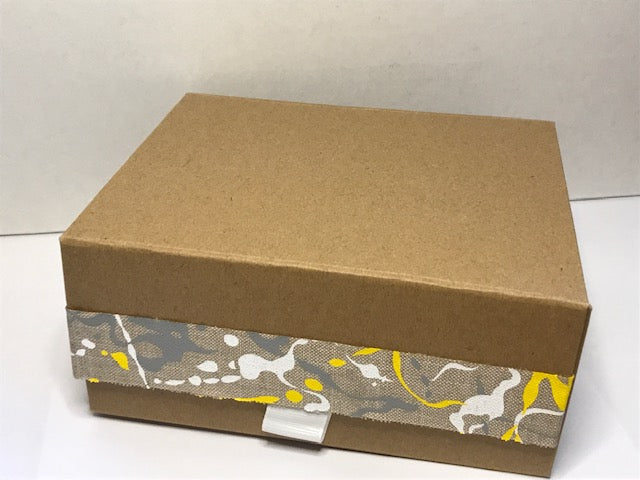 Luxury Kraft Giftbox with yellow ribbon. Re-cyclable. Comes with a snap shut lid.