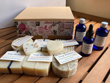 Load image into Gallery viewer, Beautiful natural skincare luxury gift box - soaps, blended oils and small heart soaps in a recyclable kraft gift box with French like ribbon