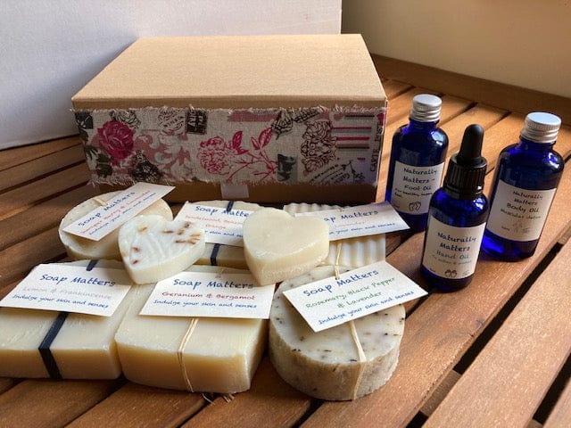 Beautiful natural skincare luxury gift box - soaps, blended oils and small heart soaps in a recyclable kraft gift box with French like ribbon